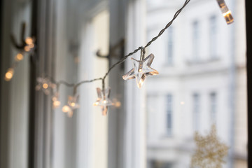 Star led lights  string in the window making Christmas mood.