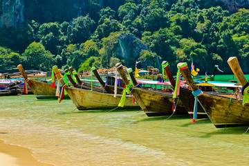 Fototapeta na wymiar Traditional fishing longtail boats on the tropical beach, Krabi, Thailand