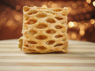 Apple lattice on a wooden surface, bokeh in the background.