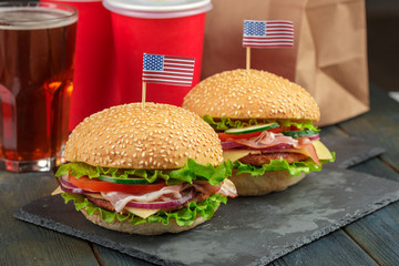 Fast food, homemade burger on a wooden background