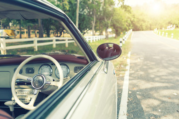 Close-up of vintage car with road - retro color effect style filtered. Travel background concept. - Powered by Adobe