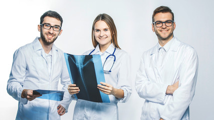 group of diagnosticians with x-rays on a white background