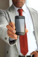 businessman with a mobile phone stock photo