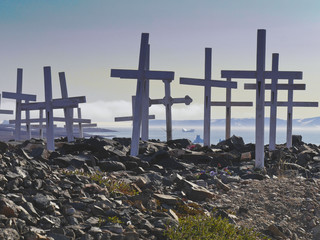 graveyard with white crosses in greenland © Christian