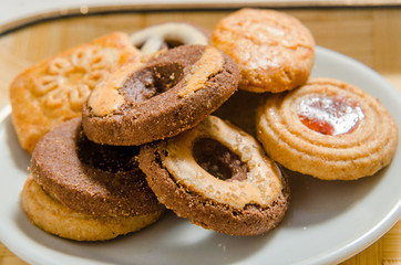 assorted cookies on wooden tray