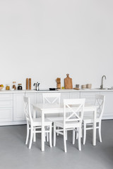dining table at modern kitchen with white brick walls