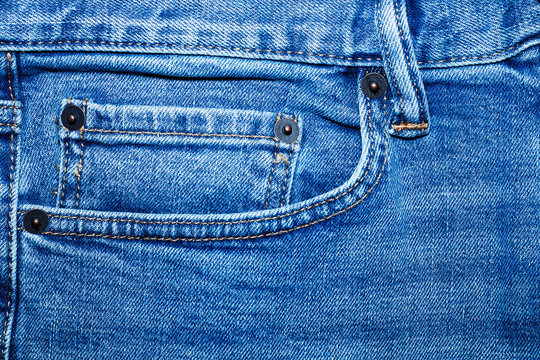 Front pocket on blue classic jeans.