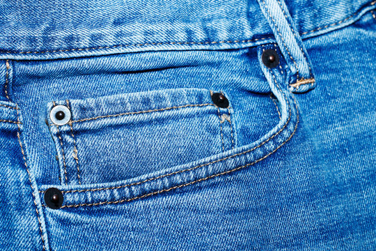 Front pocket on blue classic jeans.