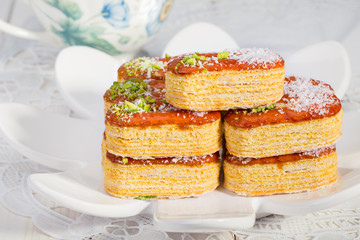 Group of Light Crunchy Puff Layered Pastry Garnished With Pistachios & Coconut Flakes Popular Persian Sweets In Iran Called Zaboon Or Zaban