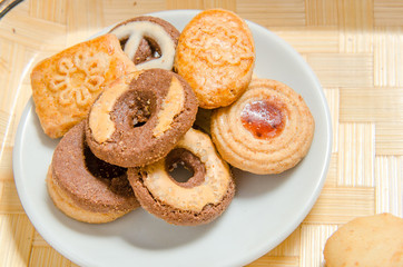 assorted cookies on wooden tray