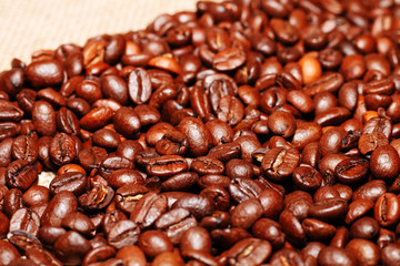 Background of beans roasted coffee and cloth burlap