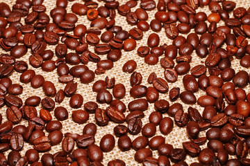 Background of beans roasted coffee and cloth burlap