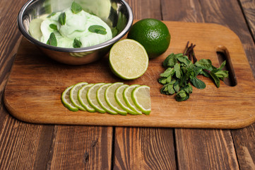 Fresh lemon and lime homemade ice cream in a white cup of milk