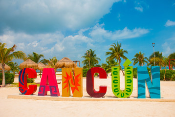 Cancun, Mexico, inscription in front of the Playa Delfines beach. Huge letters of the city name. - obrazy, fototapety, plakaty