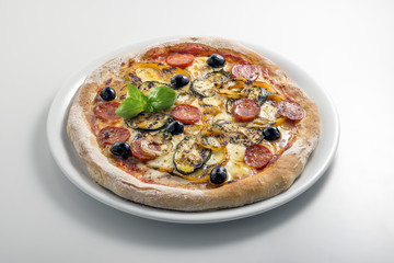 Pizza mozzarella tomato salami and grilled vegetables