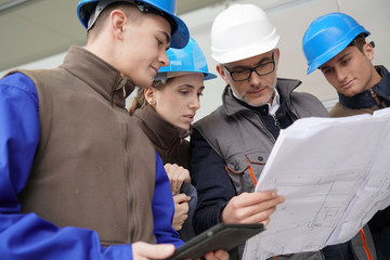 Instructor with young people in engineering training