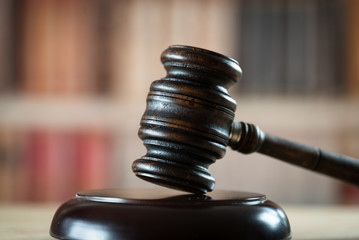 Law theme, mallet of the judge, wooden desk,