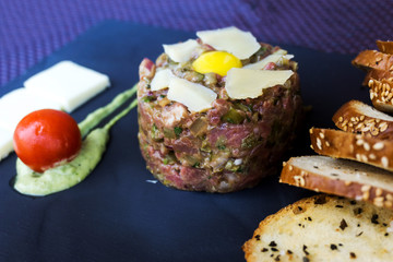 tasty Steak tartare (Raw beef) - classic steak tartare on white plate