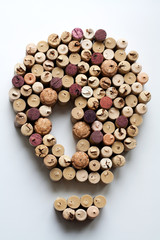 Wine corks light bulb shaped composition isolated on white background from a high angle view