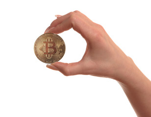 One Gold Coin Bitcoin in hand of the girl, isolated on white background.