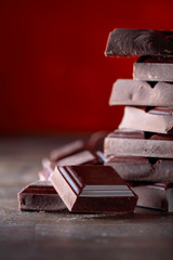 Broken black chocolate pieces.