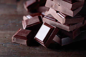 Broken black chocolate pieces.