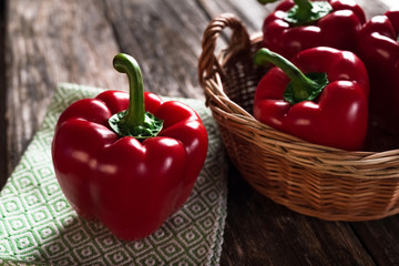 Fresh red peppers on wooden background