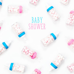 Decorative Baby milk bottles with candy. Decoration for Baby shower party. Flat lay, top view