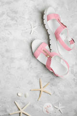 Stylish background with female summer shoes, starfish. The concept of a beach holiday