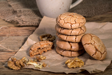 Chewy Cracked Walnut Cookies With A Cup Of Coffee On Rustic Wooden Table