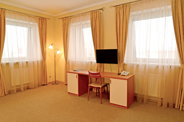 Fragment of an interior of the hotel room with a desk. Modern classics