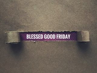 Good Friday concept - Ripped envelope with words ‘Blessed Good Friday’ in it. With grainy styled background.