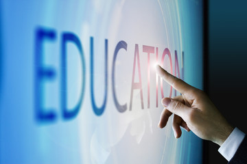 Businessman touching the screen about education