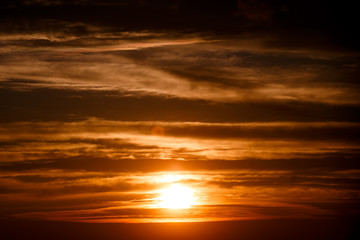 amazing sunset wallpaper. beautiful red sunset and clouds in orange sky, dramatic view. fascinating image. beautiful nature moments, breathtaking scenery