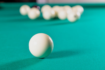 balls for Russian Billiards on a billiard table with a green cloth