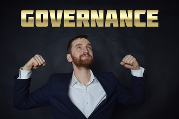 A businessman shows an inscription:GOVERNANCE