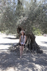 the girl next to the tree