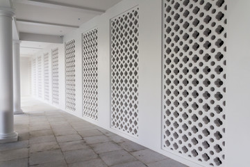 Walk walk of old style hotel with hollow concrete block wall