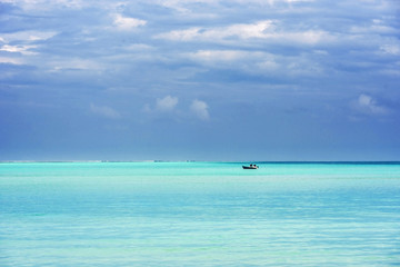 Fototapeta na wymiar Lonely boat in the Indian ocean, Male, Maldives. Copy space for text.
