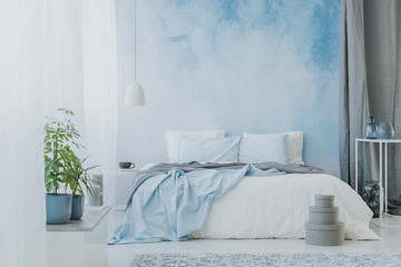 Bed on ombre wall