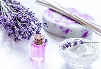Obraz na płótnie Canvas natural herb cosmetic with lavender flowers flatlay on white bac