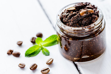 Organic scrub from ground coffee on table background