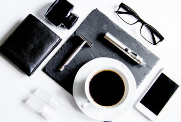 smartphone, electronic cigarette and men's accessories top view