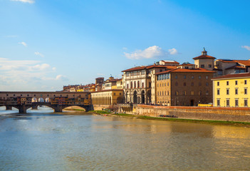 Fototapeta na wymiar View down the Arno river in Florence with museums and galleries