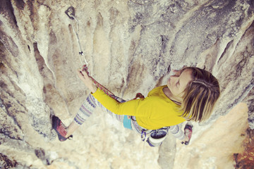 Rock-climbing in Turkey. The climber climbs on the route. Photo from the top.