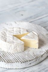 Fototapeta na wymiar Camembert cheese on the wooden board
