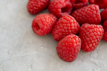 Fresh red raspberries on the table, close up.