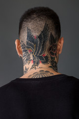 Man back portrait with tattooed neck - Eagle, ship, roses - 198472120