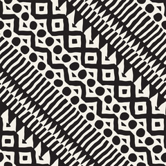 Seamless ethnic and tribal pattern. Hand drawn ornamental stripes. Black and white print for your textiles. Vector background.