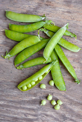 Fresh Green peas over wooden background